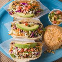 Fish Tacos · Grilled or fried fish in corn tortillas, topped with a mix of cabbages, rice, and pico de ga...