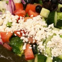 Greek Salad · Lettuce, tomato, cucumber, black olives, grape leaves, feta cheese and Greek dressing.
