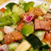 House Salad · Chopped tomato, cucumber, pepper, onion, herbs, lemon and olive oil.