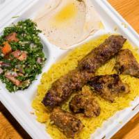 P12 Mix · Mix Of Lamb Mashawi and Sheesh Kabab, Over Rice and side of hummos and Tabouleh, Tomato Sauc...