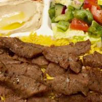 P2 Gyro Over Rice · Gyro Meat over basmati Rice, Side of Hummus. Salad and tzatziki sauce, And Pita.