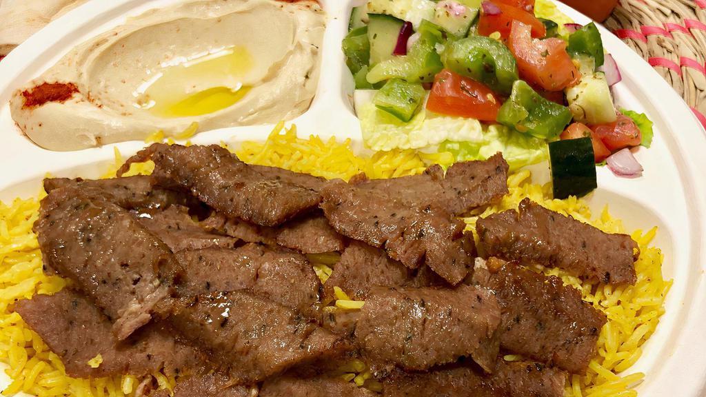 P2 Gyro Over Rice · Gyro Meat over basmati Rice, Side of Hummus. Salad and tzatziki sauce, And Pita.