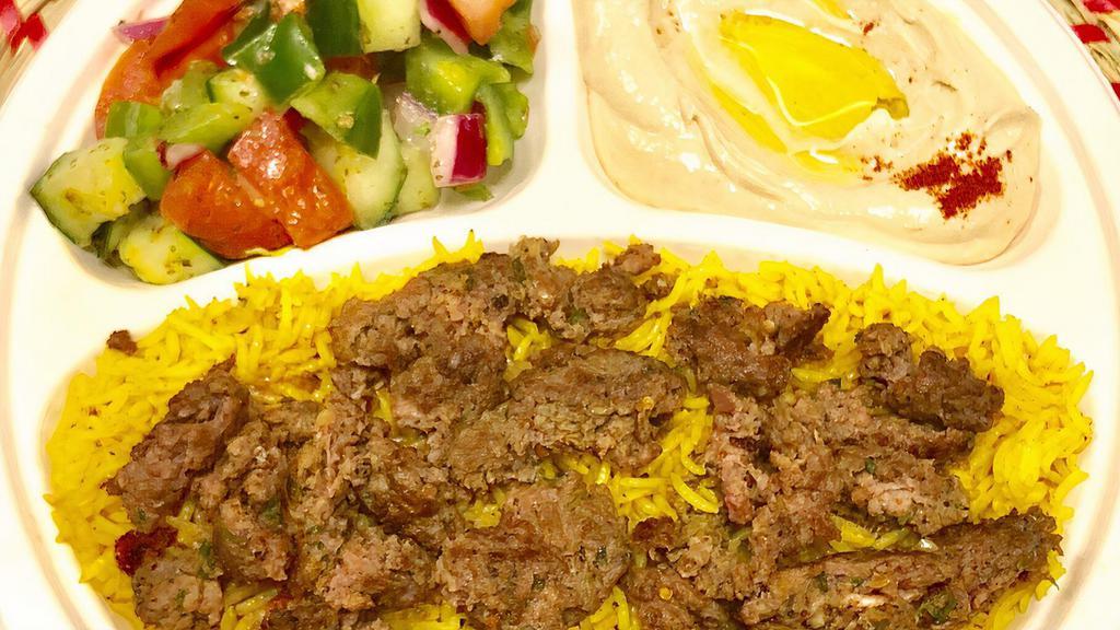 P5 Beef Over Rice · Grilled Seasoned Ground Beef over Rice , side of Hummus, salad and tahini sauce, and Pita