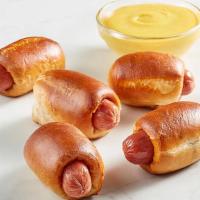 Kid'S Pretzel Dogs (5 Count) · Auntie Anne's sweet pretzel dough wrapped around a delicious bite-sized hot dog, baked to a ...