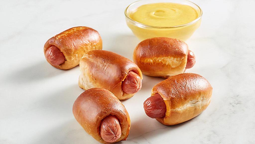 Kid'S Pretzel Dogs (5 Count) · Auntie Anne's sweet pretzel dough wrapped around a delicious bite-sized hot dog, baked to a golden perfection.  Comes with your choice of a side and a Mini Chocolate Chip Cookie