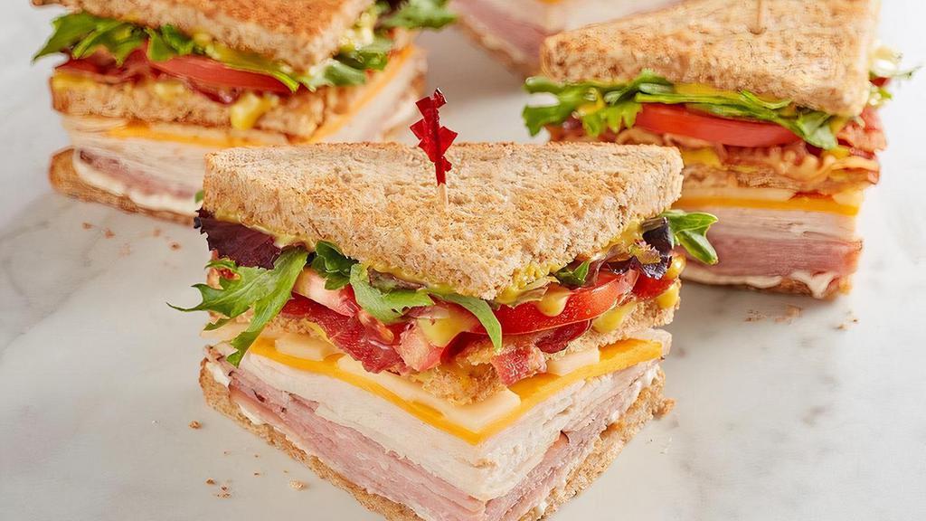 Mcalister'S Club · Smoked turkey, Black Forest ham, bacon, sharp cheddar, Swiss, spring mix, tomato, mayo and McAlister's Honey Mustard™ on wheat.