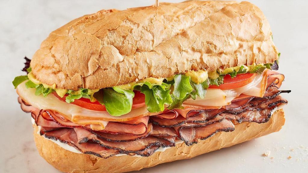 Memphian® · Smoked turkey, Black Forest ham and Black Angus roast beef, provolone, spring mix, tomato, mayo and spicy brown mustard on baguette.