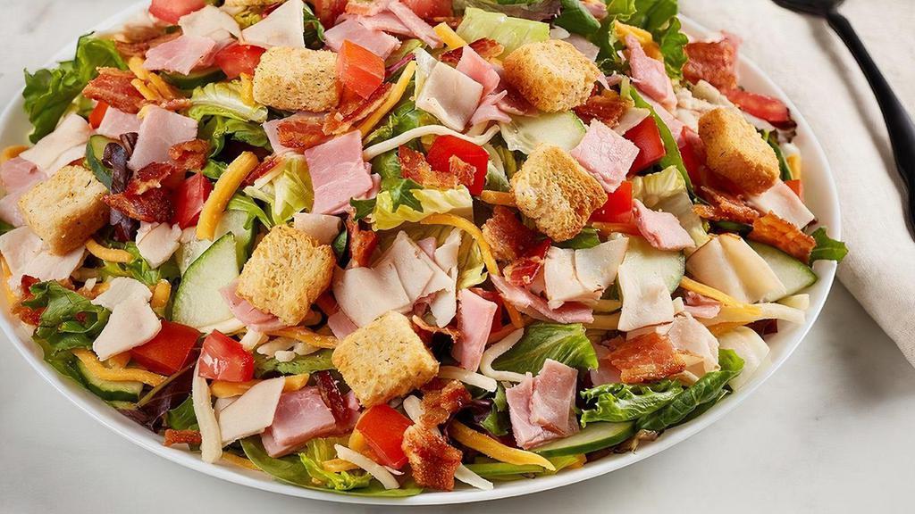 Chef Salad  · Diced Turkey and ham, bacon, cheddar-jack, tomato, cucumber and croutons on mixed greens.