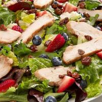 Pecanberry Salad · Grilled chicken, fresh strawberries and blueberries, candied pecans with fat-free raspberry ...