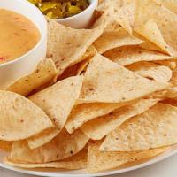 Nacho Basket · RO*TEL cheese dip, jalapeños and tortilla chips.