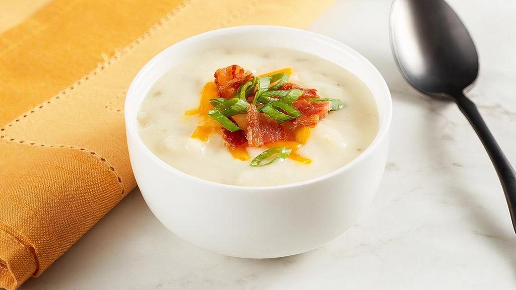 Country Potato Soup · There’s nothing like the down home taste of a hot potato soup, especially if it combines the flavors of potato, onion, bacon, chives and cheese.