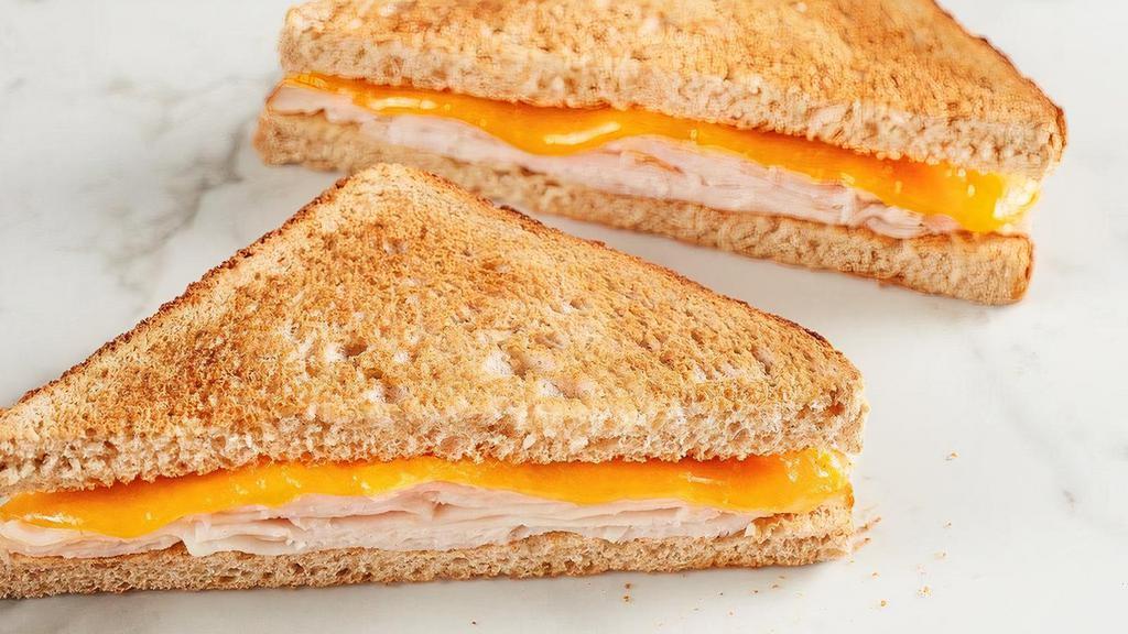 Kid'S Turkey Toastie · All-natural cheddar cheese with turkey on toasted wheat bread.