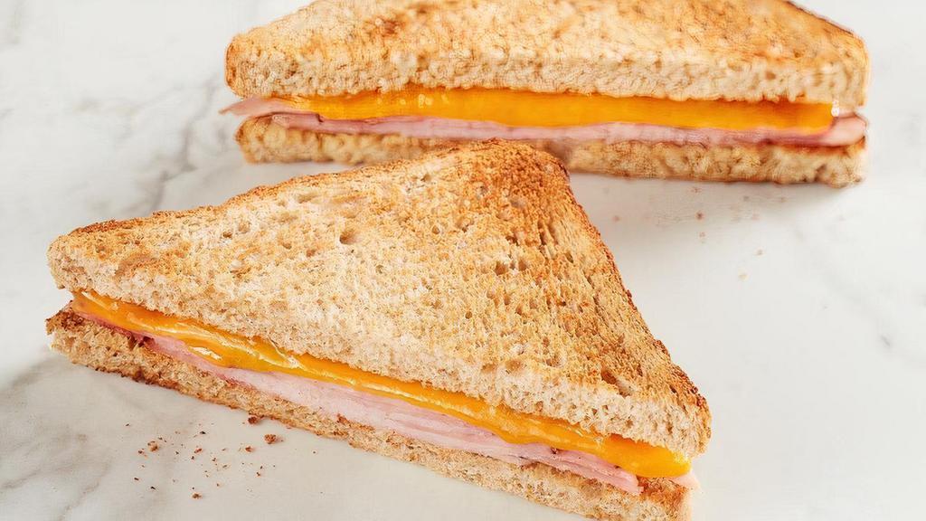 Kid'S Ham Toastie · All-natural cheddar cheese with ham on toasted wheat bread.