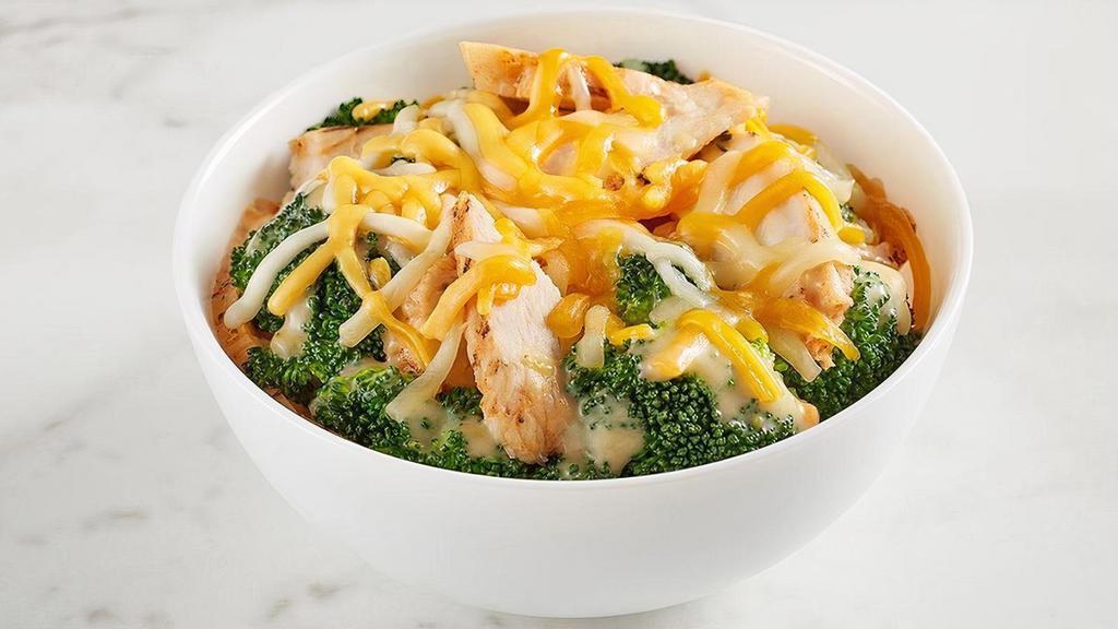 Kid'S Chicken & Broccoli Bowl · All natural chicken tossed with steamed broccoli, cheddar-jack cheese, and Broccoli & Cheddar Soup. Comes with your choice of a side and a Mini Chocolate Chip Cookie.