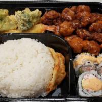 Orange Chicken Bento · California roll, shrimp and vegetables tempura, dumpling, orange chicken and steamed rice.