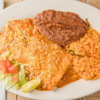 Burrito Tex-Mex #60 / Tex-Mex Burrito #60 · Carne asada, cubierto con gravy y queso. Acompañado de arroz y frijoles. / Roasted meat, cov...