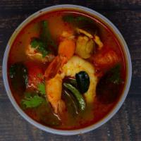 Tom Yum · Mushrooms, tomatoes, and Thai chili paste in hot + spicy lemongrass soup.