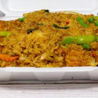 Spicy Curry Fried Rice · Stir-fried with egg, yellow onions, green beans, bell peppers, carrots and basil leaves in g...