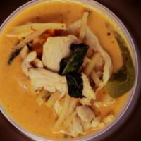 Red Curry · Bamboo shoots, zucchini, bell peppers, carrots, and basil, cooked in red curry sauce and coc...