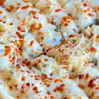 Cheese Bread · Homemade garlic butter, Italian herbs, mozzarella, and Parmesan cheese on a thick, made from...