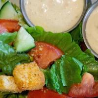 Lg Garden Salad · Romaine lettuce topped with cucumbers, tomatoes, black olives, croutons, and dressing of you...