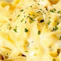 Kids Fettuccine Alfredo Pasta · 1/2 order Fettuccine noodles with our creamy Alfredo sauce and a side of garlic bread.Served...