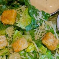 Kids Caesar Salad · Small. Romaine lettuce topped with fresh Parmesan and croutons, with our Caesar dressing on ...