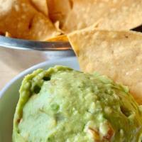 Chips And Guacamole (Feeds 1 - 2) · Our guacamole is made fresh everyday with avocados, tomatoes, onion, cilantro, and secret sp...