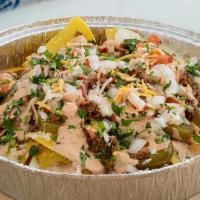Vegetarian Nachos · Build your own on a bed of chips covered in our famous queso.