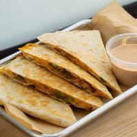 Quesadilla · 12” flour tortilla with meat, fillings and melted cheese.