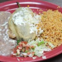 Chile Relleno · Stuffed poblano pepper with choice of picadillo beef, shredded chicken, or cheese topped wit...