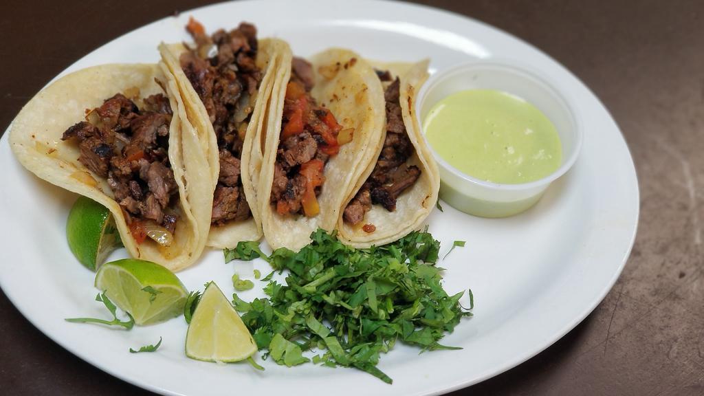 Authentic Street Tacos · Four authentic street tacos with choice of two meats: pastor, beef fajita, chicken fajita or carnitas.