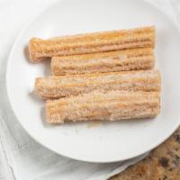 Churros · A classic Mexican treat rolled in cinnamon and sugar.