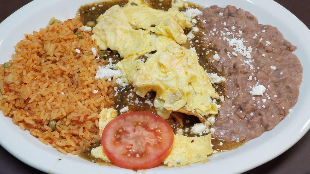 Enchiladas & Eggs · Two chicken, beef or cheese enchiladas topped with your choice of eggs. Served with Mexican rice and beans.