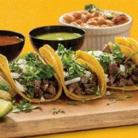 4 Street Tacos-Sirloin · Four tacos in mini-tortillas, chopped sirloin. Comes with charro beans.