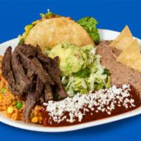 Tampiquena · Beef fajitas, enchilada roja, and a crispy taco picadillo. Includes rice, refried beans, and...