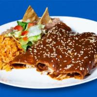Mole Enchilada · Chicken. Includes rice and refried beans.