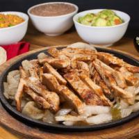 Parrillada Chicken Fajita · Includes rice, refried beans, guacamole, and tortillas.