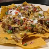 Mexican-Style Nachos / Nachos A La Mexicana · Served with refried beans, bathed in cheddar cheese, accompanied with pico de gallo.