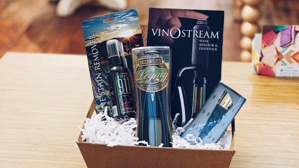 Wine Not? Red Basket  · This is the ultimate wine lover gift that includes:
- Vino 911 Wine Stain Remover 
- Corkpops Legacy: Ultimate Wine Opener
- Vinostream Wine Aerator and Dispenser 
- Royal Bottle Stopper in Gold 
Basket comes wrapped in cellophane with twine bow
