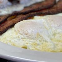 Eggs Your Way · Two eggs cooked to order with your choice of :. MEAT: Bacon, Ham, Sausage or Chorizo. BREAD:...