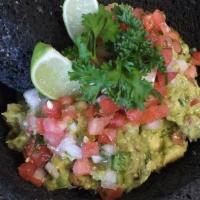 Fresh Guacamole Salad · Avocado mixed with onions, jalapenos, tomato and cilantro with a squeeze of lime.