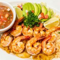 Camarones A La Plancha · Eight (8) succulent grilled shrimp. Served with rice, charro beans, and avocados slices.