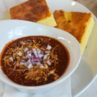 Bowl Chili · All Natural wagyu beef chili topped with shredded cheddar jack cheese & onions. Served with ...