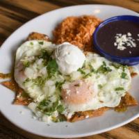 Chilaquiles* (V, Gf) · Two over-easy eggs, verde sauce, crispy corn tortilla strips, onion, queso fresco, sour crea...
