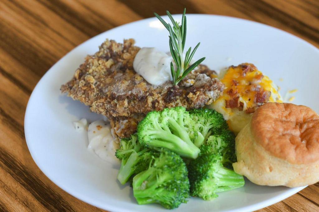 Chicken Fried Steak · Fried all-natural wagyu steak, bacon-cheddar mashed potatoes, broccoli, home-style biscuit, bacon-peppered gravy.