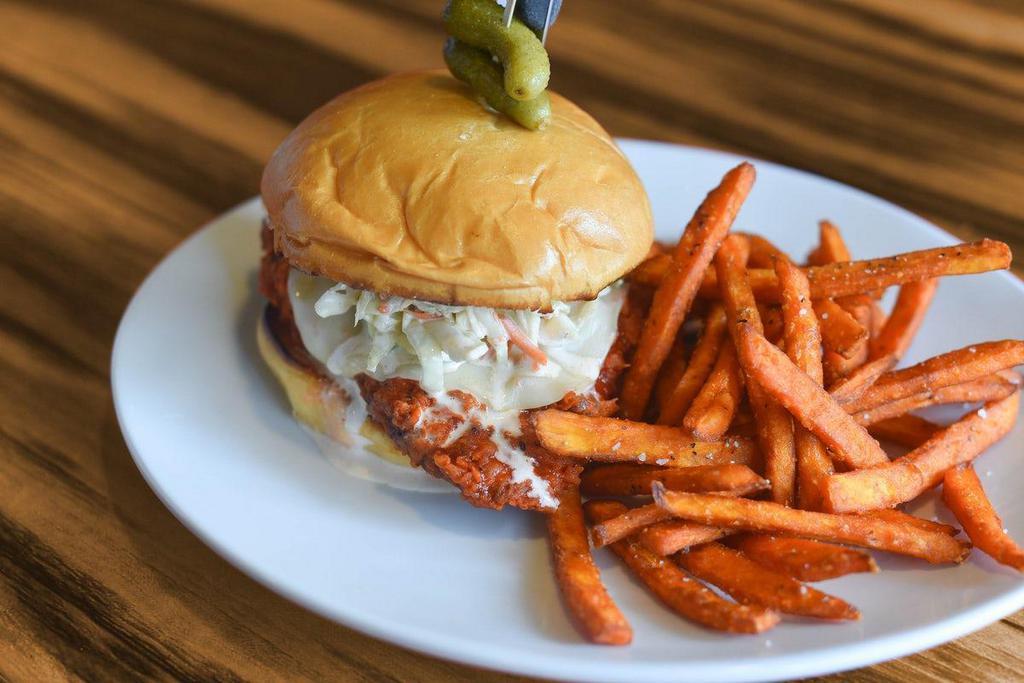 Buffalo Chicken Sandwich · Grilled or fried all-natural chicken breast. Cajun hot sauce, avocado, mozzarella cheese, coleslaw, jalapeno remoulade, grilled challah bun.