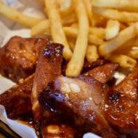 Rib Basket · Bombshells riblets slow cooked then grilled to perfection. Tossed with our sweet n spicy BBQ...