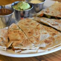 Quesadillas · A flour tortilla filled with peppers, onions and lots of cheddar cheese, grilled to perfecti...
