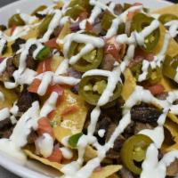 Macarthur'S Supreme Commander Nachos · A heaping helping of tortilla chips piled high with chicken or steak, spicy queso, jalapeno,...